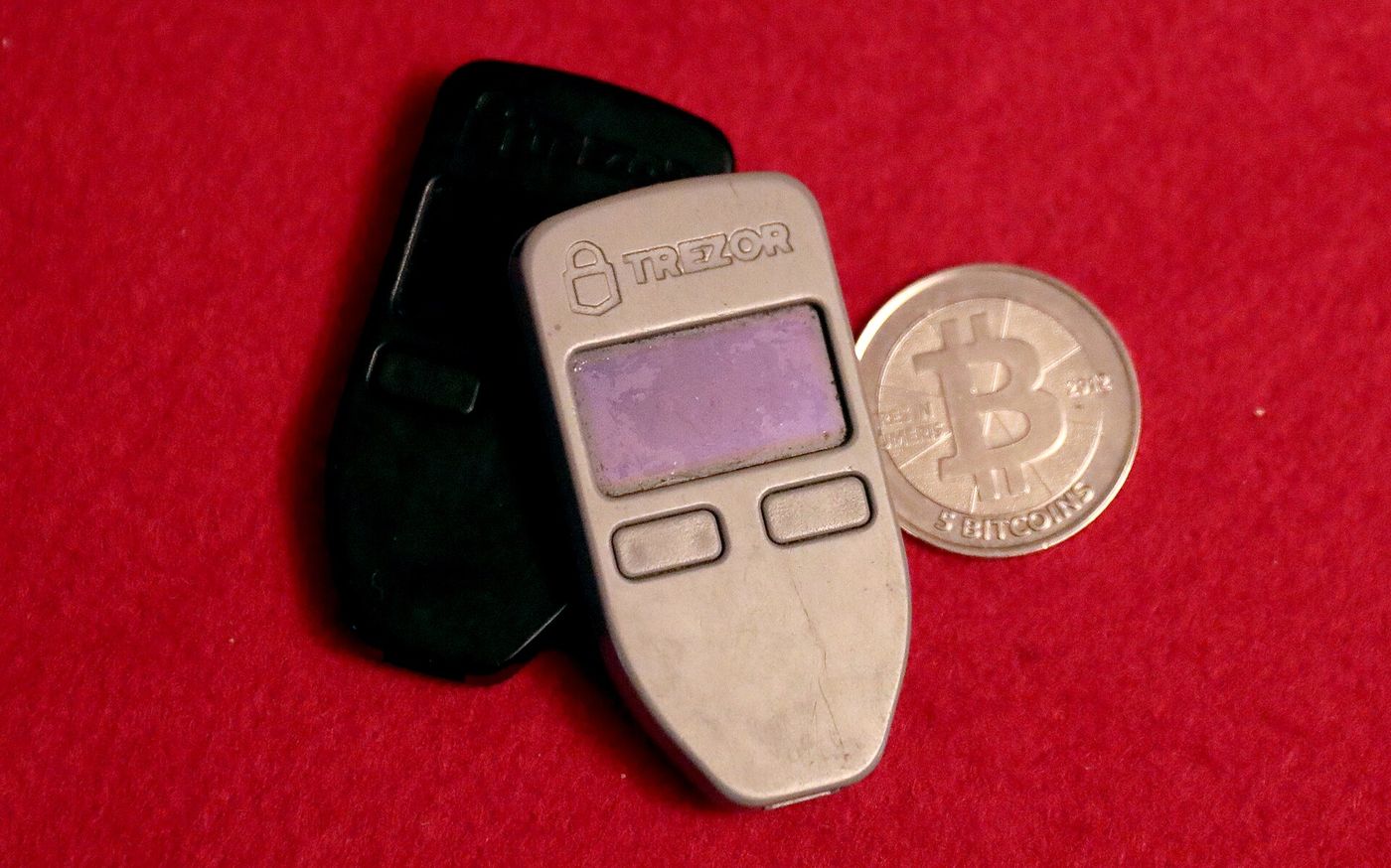 Two Trezor One hardware wallets and a 5BTC Casascius physical coin by Gage Skidmore