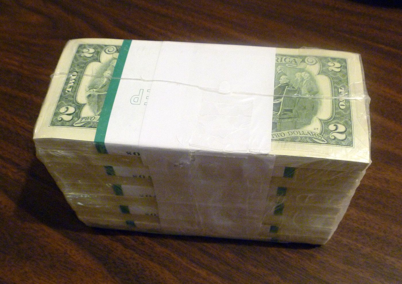 1000 United States two-dollar bills in shrink wrap